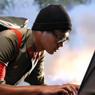 The Super Hackers avatar showing a person working on a laptop